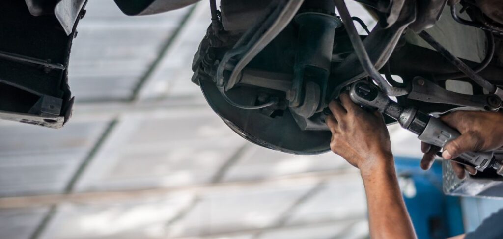 Mechanic checking bush-bolt